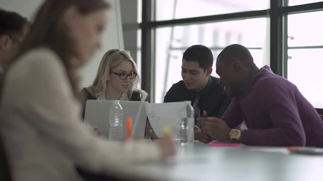 Group of attractive professionals involved in meeting