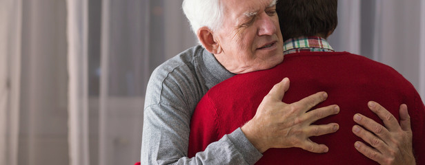 Hugging helpful caregiver