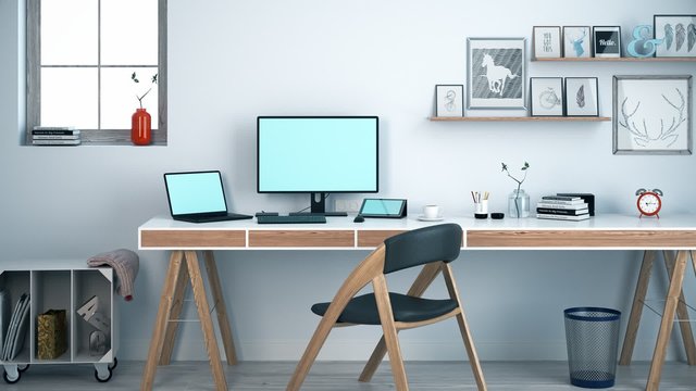 Light modern workplace with long desk and mobile devices. Home office.