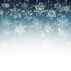 Winter background with snowflakes fading into white, vector illustration