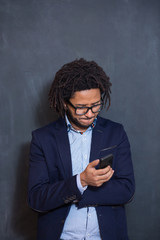 Casually handsome. Portrait of joyful young Arabic man standing