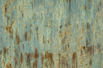 old surface of the metal sheet covered with old paint texture background