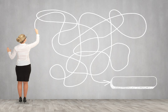 Business woman drawing on the wall. business concept

