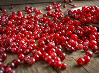 red cranberries on a wooden table