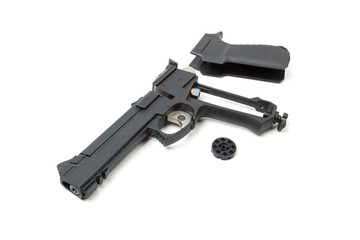 Disassembled gun, isolated
