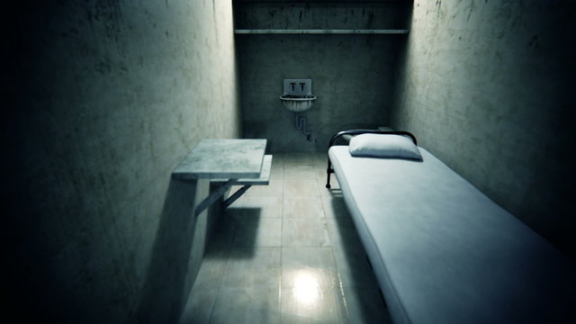 The interior of a single prison cell with minimal furnishings. Isolation. HD
