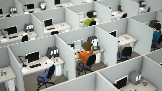 View of the corporate open room with white cubicles and employees working in it.
