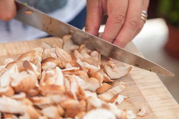 Slicing mushrooms.