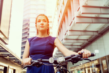 Obraz na płótnie Canvas Young woman commuting on bicycle