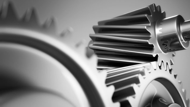 The motion of silver gears working together in endless rotation. Loopable. HD