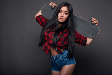 Attractive young asian woman in funky clothes