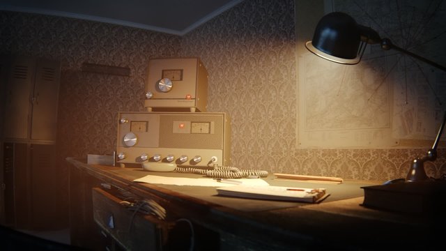 Vintage radio equipment on a moody desk under a lamp