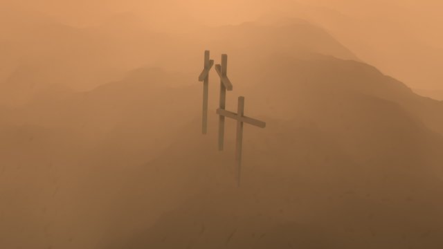 Atmospheric, dark image of three crosses silhouetted on the top of a mountain.