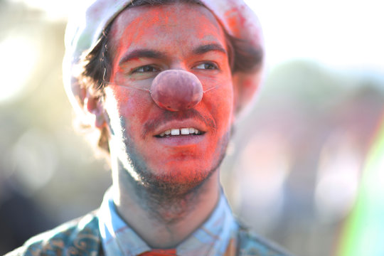 Closeup portrait of a clown at Holi festival