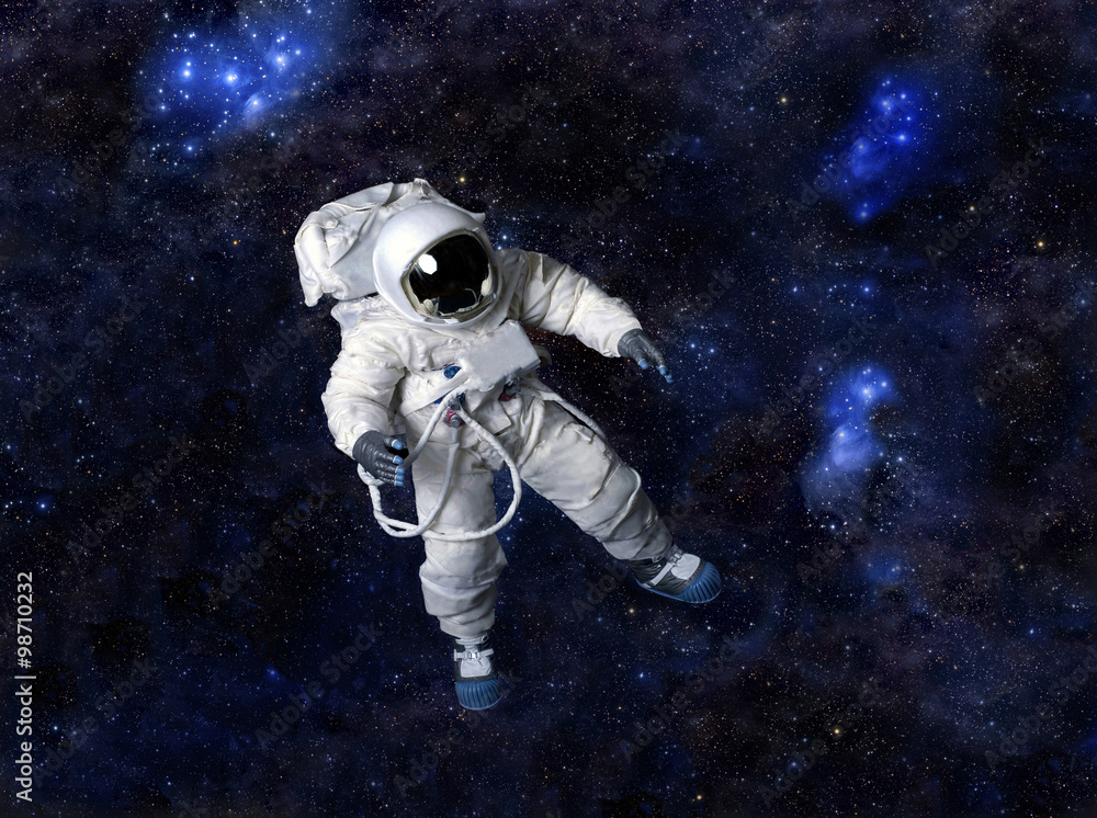 Canvas Prints astronaut floating in dark space.