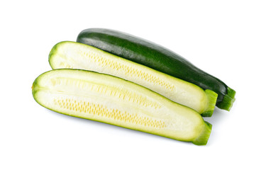 whole and half cut fresh Zucchini on white background