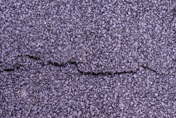 Cracked asphalt on road texture.