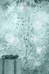blue background from christmas tree decorations and dry plants