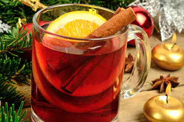 Mulled wine with candles and branch tree