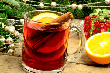 Glass with red wine and orange fruit