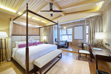 interior of modern bedroom with comfortable bed and sofa