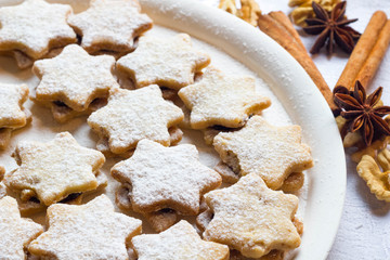 Star shaped linzer cookies filled with plum jam.