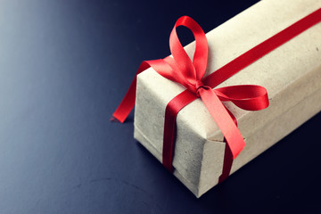 gift red bow black background