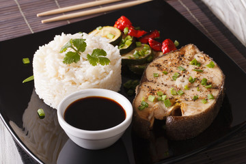 Japanese food: Steak fish and rice close-up on a plate. horizontal
