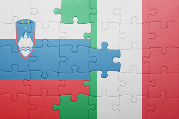 puzzle with the national flag of italy and slovenia