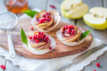 Homemade Apple rose cake on wooden background, selective focus