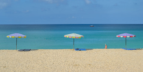 Colorful beach umbrella against the bright sky at Surin Beach in Phuket ,Thailand