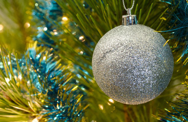 Christmas spruce with decorative bauble and garland lights. Banner template for winter sales and seasonal discounts. Happy New Year!