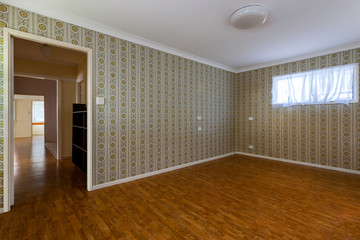 Empty room with decorated walls