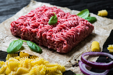 Raw ground beef, pasta and spices