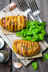 Homemade baked potato with bacon and herbs