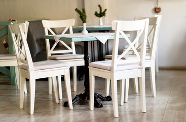 White chairs and a table in a restaurant