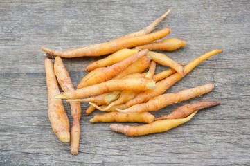 fresh fingerroot on wood plank