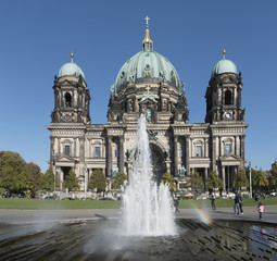 Berlin Cathedral. Fountain in front of the facade with rainbow. Berlin, Germany