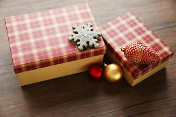 Box with Christmas toys on wooden background