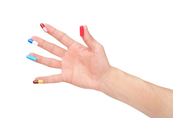 Hand and pill isolated on white background