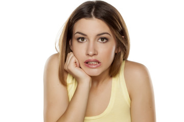 Fototapeta premium frightened beautiful young woman looking at the camera