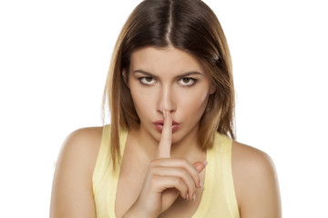 Fototapeta premium finger on her lips, gesture for silence
