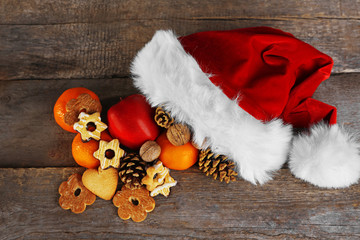 Obraz na płótnie Canvas Santa hat filled with Christmas gifts, close-up