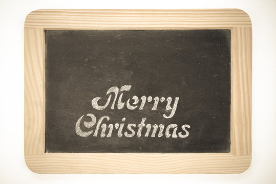 Wooden frame vintage chalkboard with Merry Christmas message, isolated on white