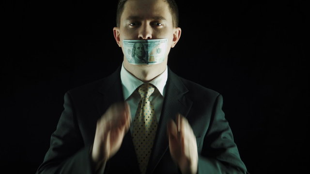 The politics in a suit closes mouth the hundred-dollar note 