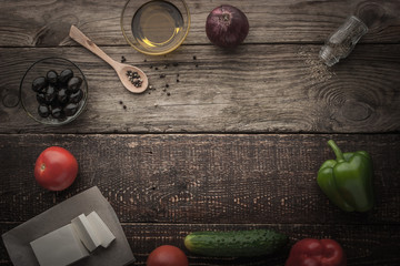 Ingredients for Greek salad on the wooden table horizontal