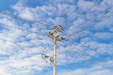 electric pole power lines and wires with blue sky