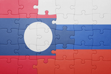 puzzle with the national flag of laos and russia