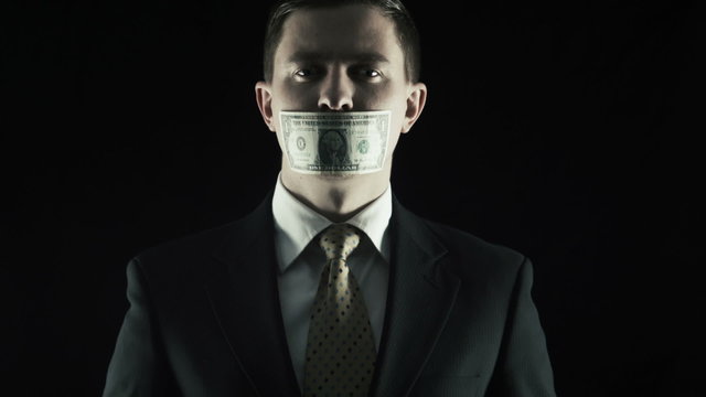 Corruption, The person in a suit closed a mouth by US dollar
