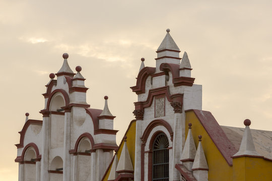 Historic colonial church in Trujillo with sunset light on main s